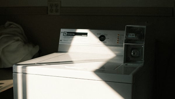 A dryer with a ray of sunlight shining on it.