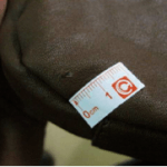 An AQF sticker pointing out the holes and scratches on a chair product