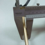Using a vernier caliper to measure the diameter of a metal pole