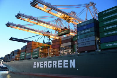 A green and grey Evergreen cargo ship.