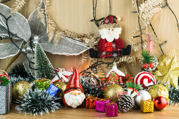 Different kinds of holiday decoration items are put together on a desk