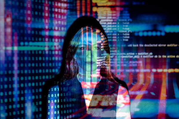 Code projected over a woman