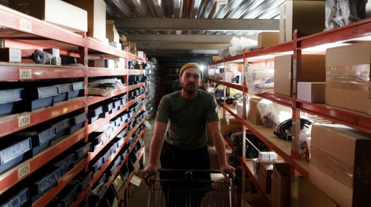A man pushing a cart