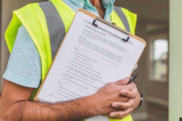 A professional inspector conducting regular environmental audits.