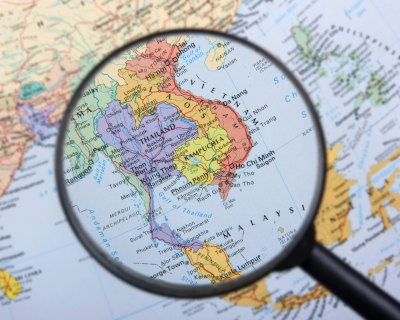 magnifying glass over Asia