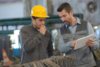 Men Checking Materials